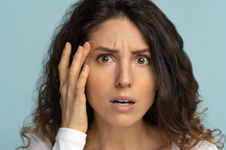 Worried woman checking for wrinkles
