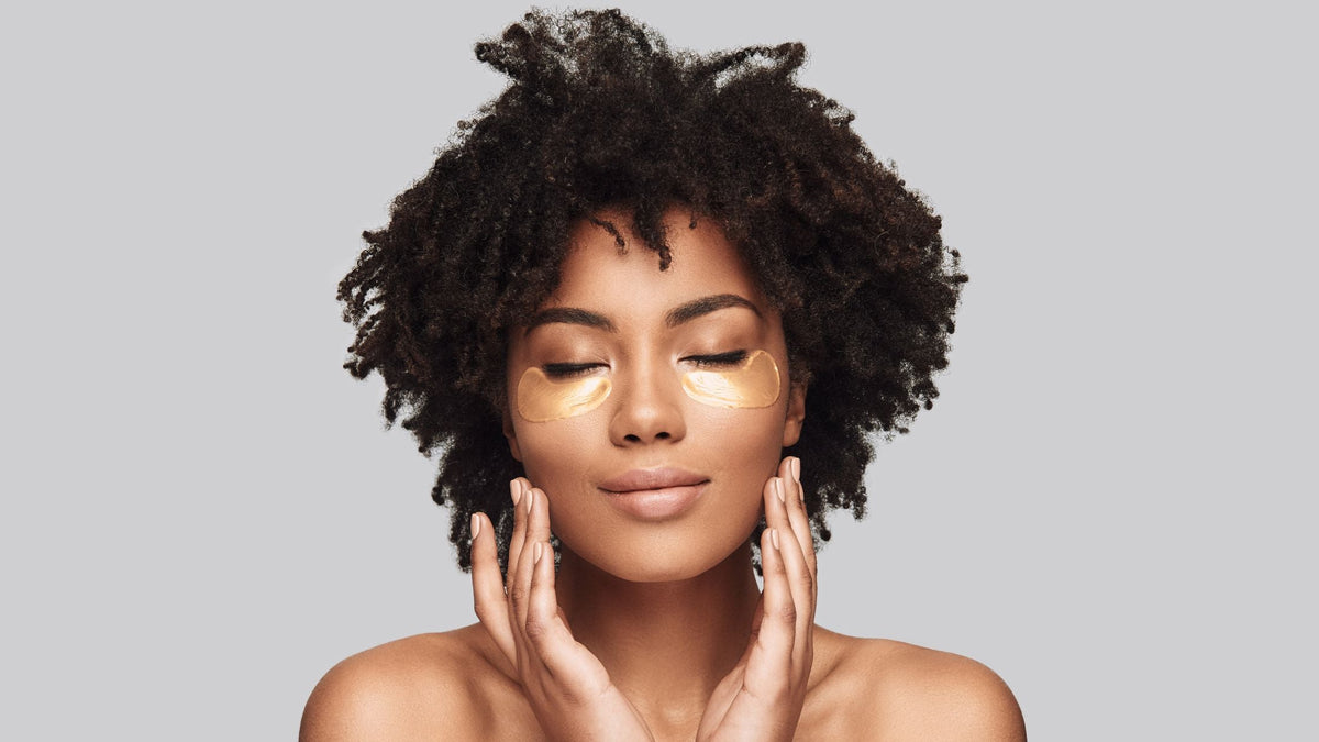 Woman applying skincare eye patches