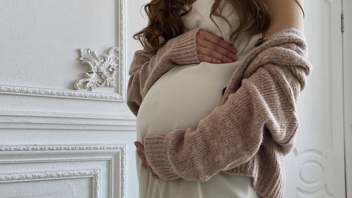 Pregnant Woman Holding her Belly