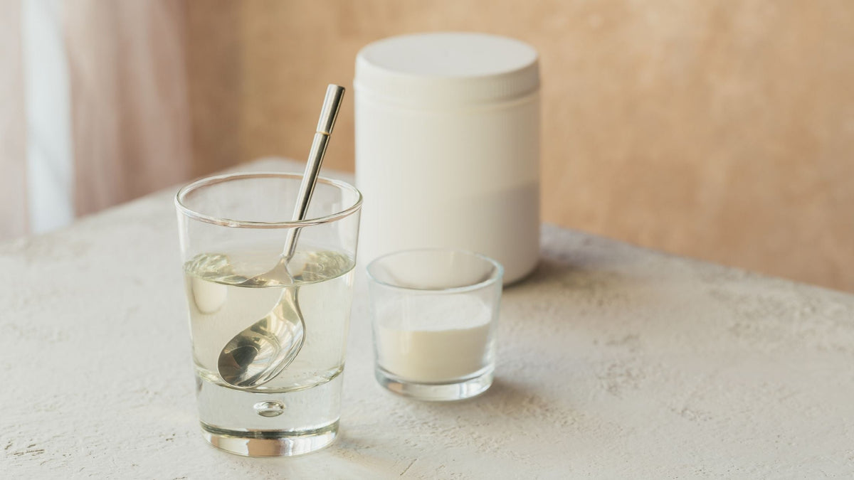Collagen powder mixed into cup of water