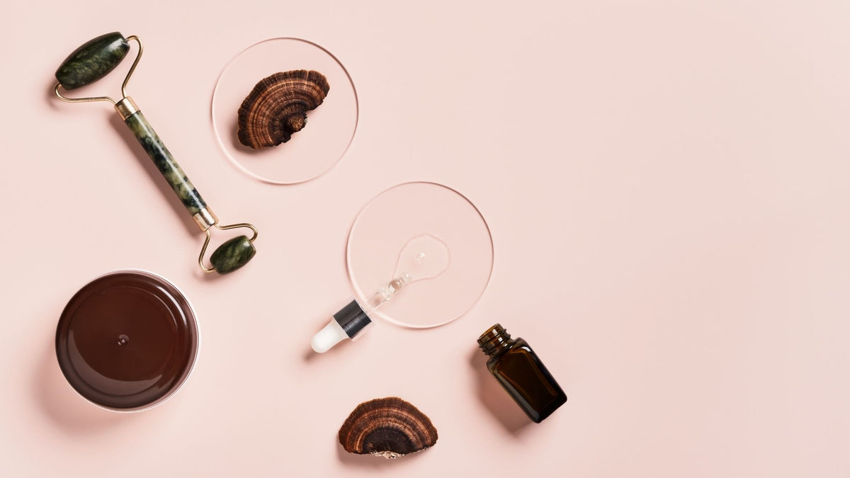 Cosmetic beauty products with mushrooms on pink background. Mushroom skincare concept