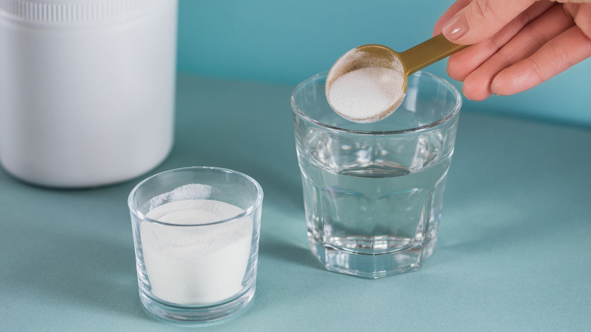 Glass with collagen dissolved in water and collagen powder