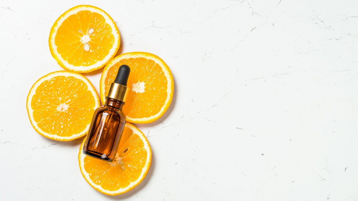 Vitamin C skincare serum on top of orange slices