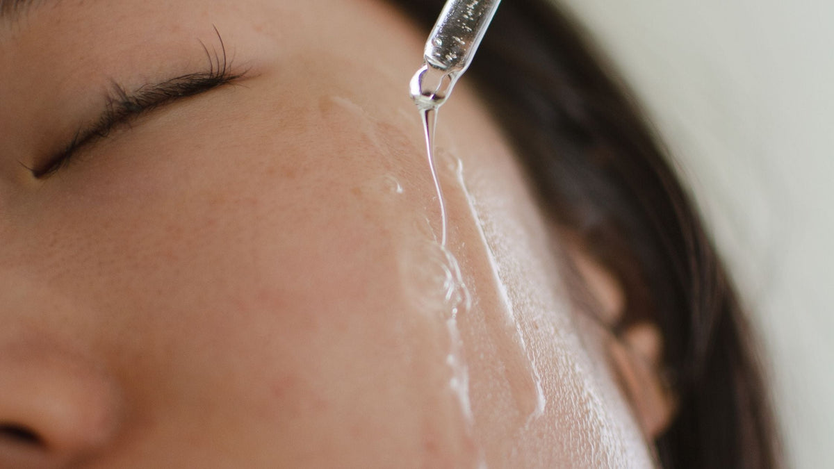 Woman Applying Skincare Serum