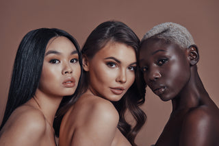 three women on a brown background
