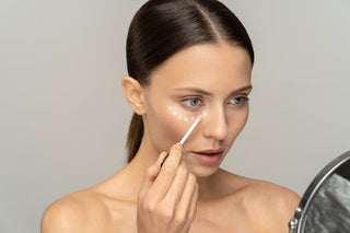 woman applying eye cream